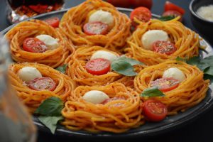 Delicious spaghetti with fresh cherry tomatoes and cheese for lunch